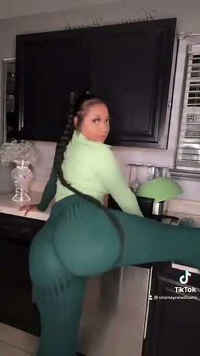 Tight green pant huge boot twerking