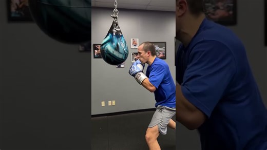 Gloves on & world off Andreas Katzourakis shows off great combinations & power on the aqua bag