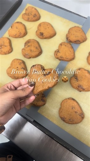 Mehak Mehta on Instagram: "Brown butter chocolate chip cookies, baked fresh and shaped with love 🤎 Crisp edges, soft centres, rich nutty notes from brown butter, and melty chocolate in every bite. Because cookies taste better when they’re made from the heart ♡ #brownbuttercookies #heartshapedcookies #explorepage #foryoupage #barmer (brown butter, chocolate chip cookies, heart shaped cookies, freshly baked, artisanal cookies, small batch baking, gourmet cookies, bakery style cookies, dessert lov