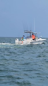 Dude in the other boat reeling a shark in . | Shawn Hedrick