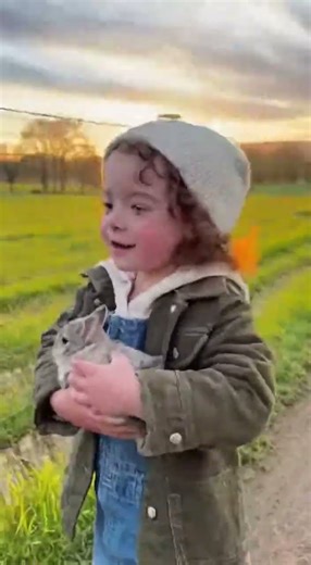 Little Kid Leaps with Bunny Over Fence While Mother Rabbit Gives Chase