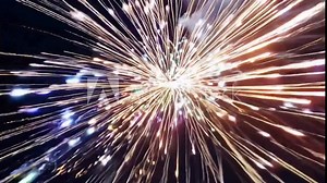 Hyperspeed FPV shot- Fireworks exploding in rapid succession, creating a strobe-like effect against a dark sky. The camera follows the dynamic and intense display, highlighting the fast-paced and exhi
