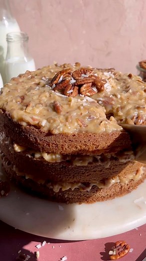 German Chocolate Cake for Thanksgiving? Don’t mind if I do 🥳 And who can resist three moist, tender layers of chocolate cake covered in the best traditional coconut pecan frosting? #chocolatecake #cakestagram #BakingJoy #DessertLovers | Blue Bowl