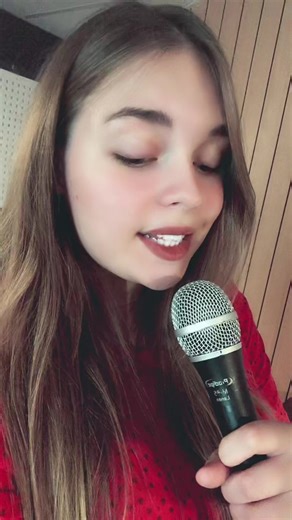 Singing Performance with a Stylish Red Outfit