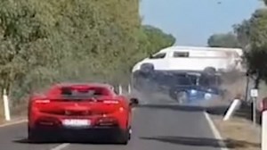 Terrifying moment campervan flips after horror supercar smash