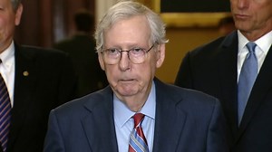 Mitch McConnell escorted away from cameras after freezing during a news conference