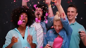 mixed race people celbration and party with confetti shower