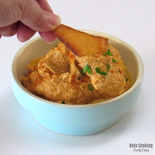 Roasted red peppers and cauliflower star in this Keto friendly hummus recipe with all the rich flavors of traditional hummus but without all the carbs! https://ketocookingchristian.com/roasted-red-pepper-cauliflower-hummus-keto/ | Keto Cooking Christian
