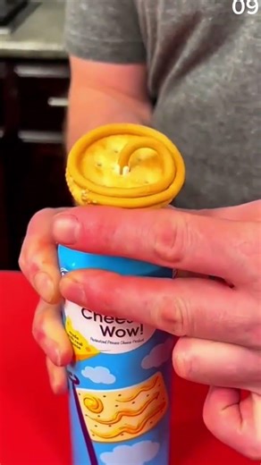 Dispensing processed cheese playfully through cracker center