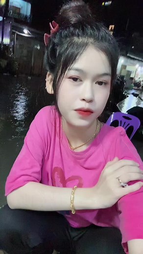 Bright Pink Fashion in a Nighttime Urban Setting