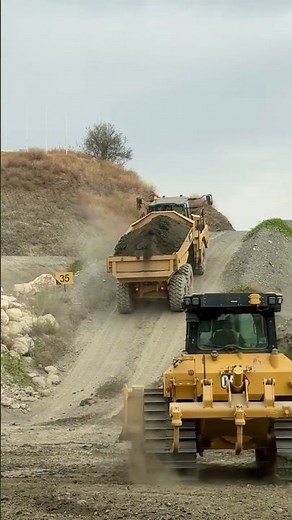 the articulated truck tackle a grade using the Automatic Traction Con #tractrac