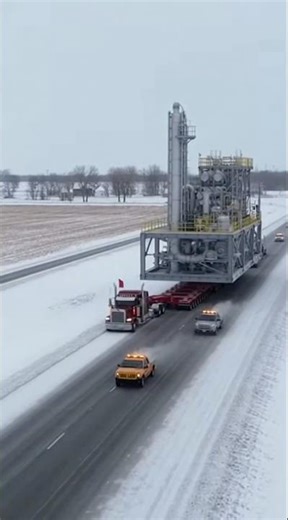 Massive load moves slowly on highway