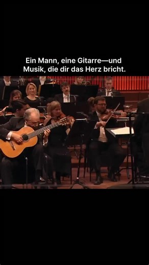 Reels Classics • Klassische Musik on Instagram: "🌅🎶 Joaquín Rodrigo – Concierto de Aranjuez Danish National Symphony Orchestra — Rafael de Burgos & Pepe Romero 🎸🎻 • Das Concierto de Aranjuez ist Joaquín Rodrigos berühmtestes Werk und eines der großen Symbole der spanischen klassischen Musik. Mit seiner Mischung aus Melancholie und Glanz beschwört das Konzert Gärten, Abendlicht und die tiefe Seele der spanischen Gitarre herauf. Der berühmte zweite Satz mit seinem lyrischen, unvergesslichen Th