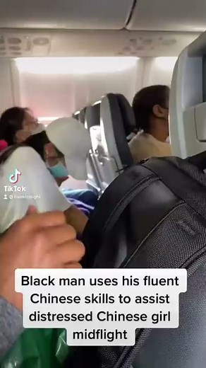 Black man uses his FLUENT Chinese to help distressed passenger MIDFLIGHT !