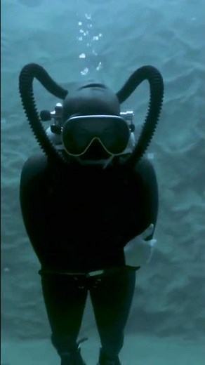 Rubber Wetsuit Girl Looks At You.