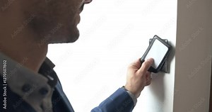 Businessman using card scan electronic key access system unlock the door and going to work.