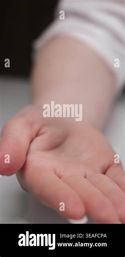 Woman pouring capsules from bottle into hand, medication or supplement use, healthcare concept in clean minimal environment Stock Video Footage - Alamy