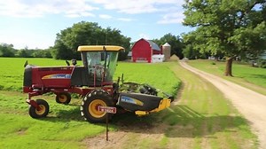 clip-7635187-farm-tractor-cutting-alfalfa-hay