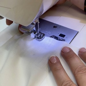 G is for Gathering! Attach a gathering foot. Select a straight stitch and increase the stitch length. Lightly place a finger behind the foot to start stitching as you get started. Tip: Increase upper thread tension to get more fullness in your gathers. Recommended for lightweight woven fabrics. #sewingatoz #itstartswithastitch #singersewingmachine #sewingtips #tipsandtricks | Singer North America