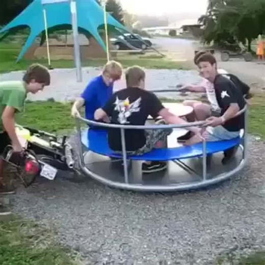 WT Fails Daily on Instagram: "This video brings back some wild memories of pushing the limits, though perhaps not always with the best judgment. You see a group of guys, a merry-go-round, and then a motorbike gets involved to really amp up the speed. The sheer centrifugal force eventually takes over, and it's less about riding and more about holding on for dear life. You can see how quickly things escalate from fun to a potential mishap. It's a clear demonstration of what happens when physics me