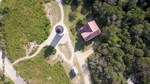 Top-down View Of Nauset Lighthouse With Cars Driving On Beach Road During Summer In Cape Cod, Eastham, Massachusetts. - aerial