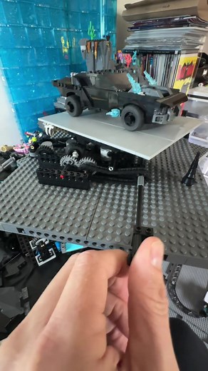 LEGO batmobile conveyor.. again.. lol.. I think I finally figured out a better design that solves many of the problems with the “train” style that I posted a couple of times.. this design should allow much slower speeds and efficiency. It also doesn’t require the motors and batteries to be onboard moving with cars.. this is important so that it is easy to turn on and off without having to chase down where the 3 or more on switches have moved to. I’m a little embarrassed that I didn’t try it soon