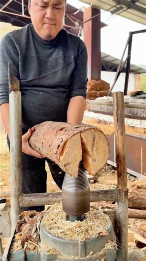 This Spiral Wood Splitter Easily Tears Logs Apart Using a Giant Rotating Screw
