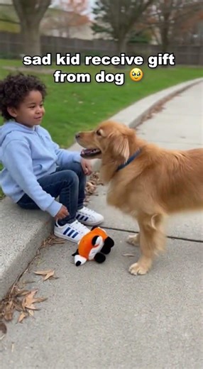 A sad kid receives something from dog 😭