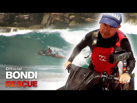 Lifeguards Race To Rescue Two Swimmers Caught In Huge Surf