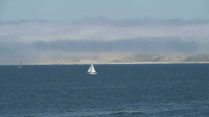 Sailing Boats and Ships at Monterey Bay California with Clouds on the Background