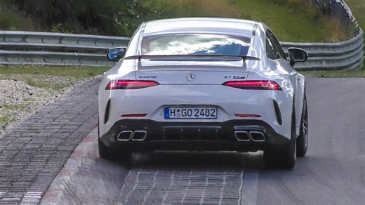 Mercedes AMG GT 63 driving aggressively over Nürburgring curbs
