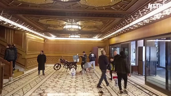 Syrians inside the presidential palace in Damascus following Al-Assad's ousting