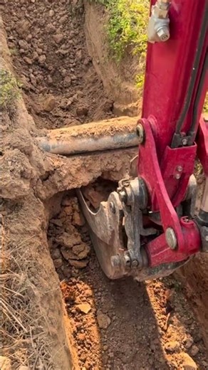 the process of digging the ground under the pipe