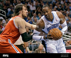 Milwaukee Bucks' Andrew Bogut, left, grabs Orlando Magic's Dwight Howard, trying to slow him down on a move to the basket during the second half of an NBA basketball game in Orlando, Fla., Tuesday, April 5, 2011. Orlando won 78-72. (AP Photo/John Raoux Stock Photo - Alamy