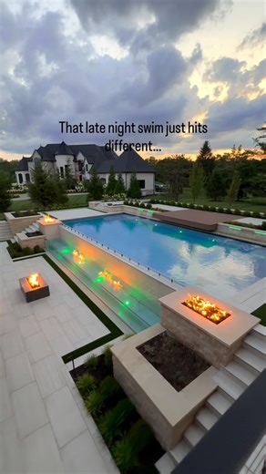 WayUp Media | Content Creation | Social Media Management on Instagram: "Who would you have over for a late night swim? 🤫🤭 And yes, you did see that correctly. THERE IS FIRE COMING OUT OF THE WATER. 🔥💦 Imagine hosting with a backyard like this. I would never leave"