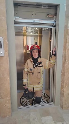 Firefighter Demonstrates Elevator Safety Protocols