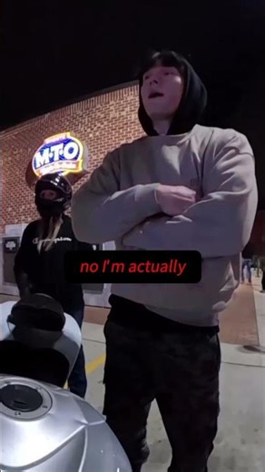 Biker Stopped For Flipped Plate Tries To Get Out Of It