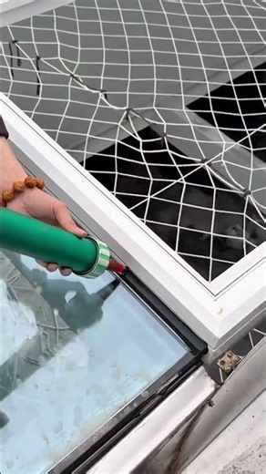 Applying waterproof sealant to window frames and cracks to prevent water leakage at home