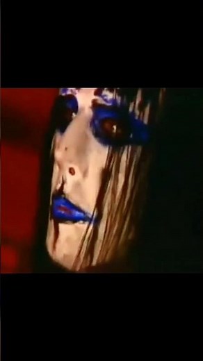 Joey Jordison wearing one of his rarest masks—the blue mask, worn only once in Poland in 2002.