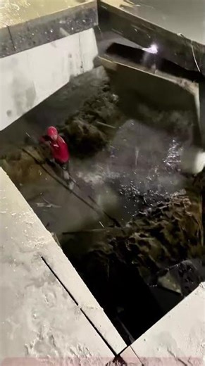 Concrete Cutting Scene: Worker Uses Saw to Demolish Thick Slab