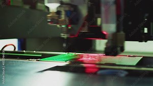 High-precision assembly of complex components of modern elements for electronic devices. Modern industrial equipment for the production of electronics. Technological process. Close-up.