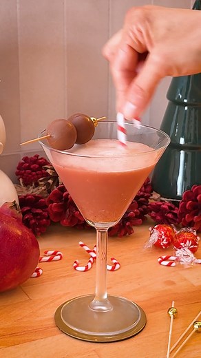 😤➡️😇 Delight the Scrooges in your life with this festive take on a classic sour mocktail. A splash of pomegranate juice and a dash of pumpkin spice will take even the grumpiest from naughty to nice. Ingredients: 1½ oz iced lemon tea ¾ oz fresh lemon juice ½ oz pomegranate juice ¾ oz simple syrup ½ teaspoon pumpkin spice 1 raw egg white (optional) 3 foil-wrapped chocolate balls (for garnish) Directions: 1. Shake iced lemon tea, lemon juice, pomegranate juice, simple syrup, pumpkin spice and egg