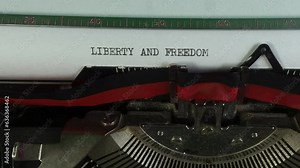 Typing Liberty and Freedom on an old manual typewriter.