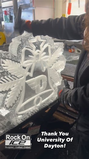 Rock On Ice on Instagram: "Raea is in full prep mode for a special creation heading to the University of Dayton this Christmas season! The theme says it all: “Every time the bell rings, a Flyer gets his wings!” Watch the video and see the magic start to take shape. 🪽✨ We appreciate your business. #RockOnIce #IceSculpture #UniversityOfDayton #Flyers #EventArt #IceCarving #UDayton #BehindTheScenes"