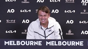 Holger Rune explains what Severin Luthi brings to team as new coach watches answer in press room | Australian Open