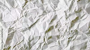 Seamless paper texture background for overlays. Looping white grunge paper texture. White Paper stop motion background. White paper texture background. Surface Texture Background with fast Highlights.
