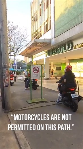 Manila Bike Commuter on Instagram: "“Motorcycles are not permitted on this path.” And yet they continued to pass. 🙄 The situation reminded me of the meme, “That sign won’t stop me because I can’t read!” 😅 That’s why I don’t agree with the idea that “dapat pagamit ang bike lane sa mga motorista kapag matrapik”, because motorists won’t stop with bike lanes. They’d pass pedestrian paths, and would even honk at pedestrians. If they can pass through your house to “beat traffic”, they probably will.