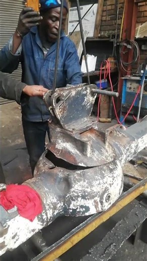 REPAIRING TRACTOR DIFFERENTIAL HOUSING HUB USING HAMMER, TIG WELDING AND CRANE