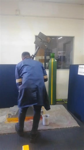 SWINGING AND LANDING HEAVY HAMMER TO BREAK V-NOTCH IMPACT SAMPLE ON CHARPY MACHINE