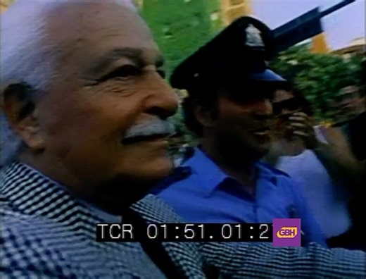 Legendary Boston Pops conductor Arthur Fiedler makes his way to Boston's Hatch Shell for Fourth of July concert, 1970s. | GBH Archives